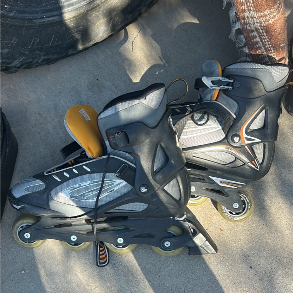 Black and Gray Inline Skates with Orange Accents